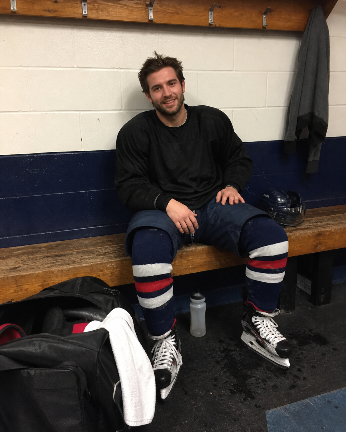 Hockey player showing a full equipment setup
